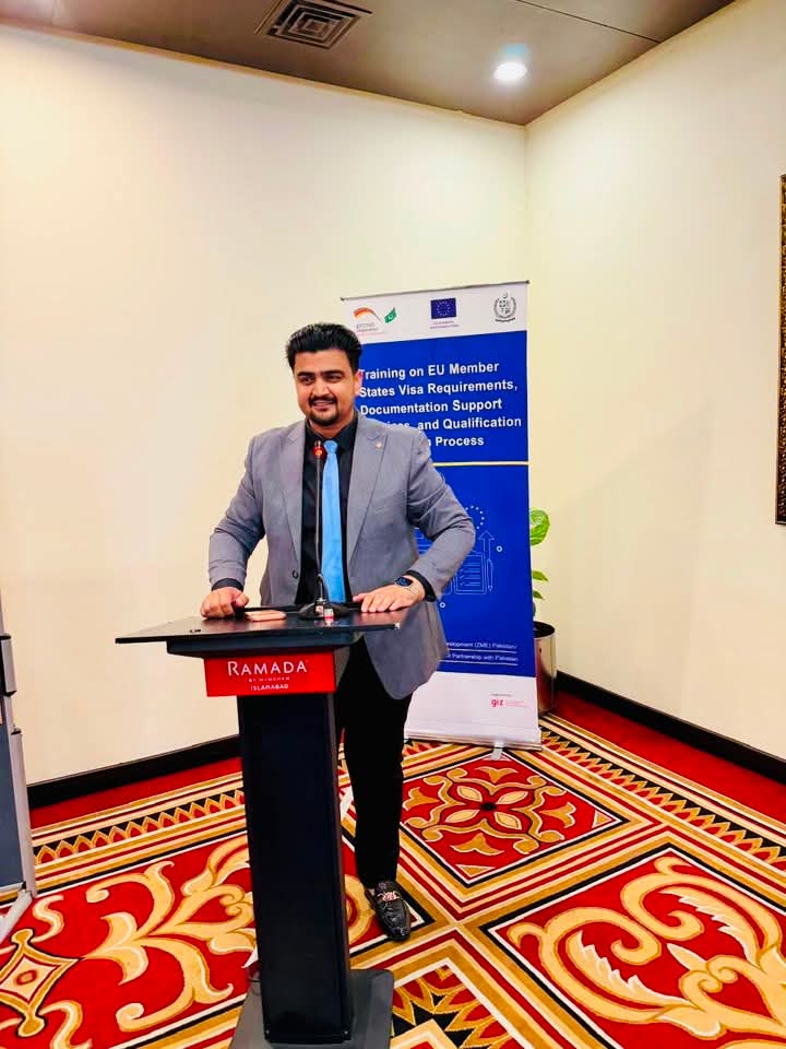 Ejaz Mehmood Khadim Choudhry speaking at the podium during the EU training session on visa requirements, documentation support and qualification recognition at Ramada Hotel, Islamabad
